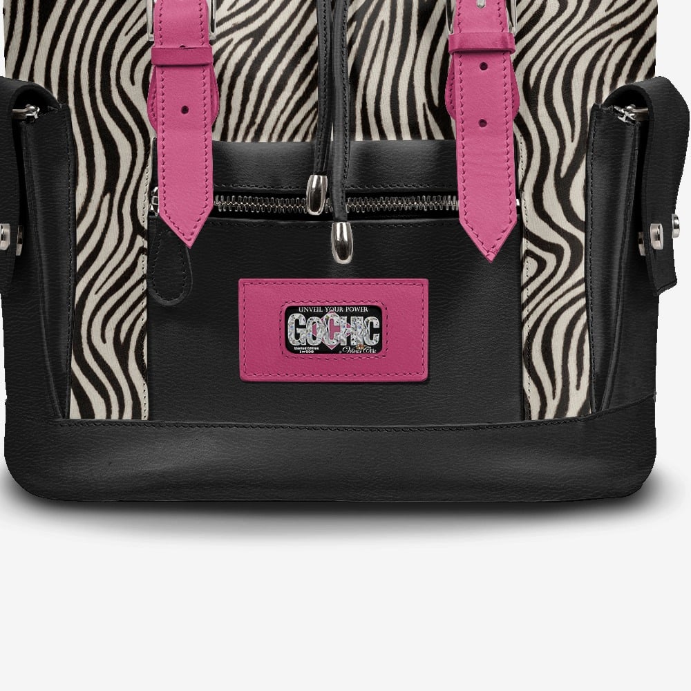 Close-up of GoChic™ Backpack’s premium leather and pink-tone details